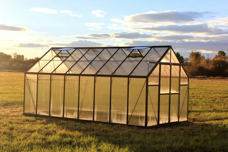 greenhouse in a field with a scenic  background side view
